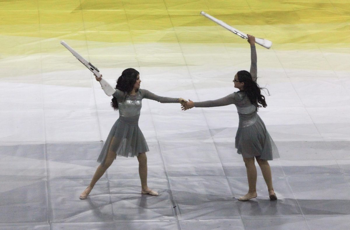 Sophomore Alexandra Arreola and Freshman Yaslin Lopez grab each other's hand.