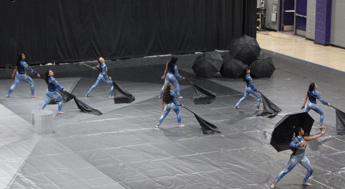 Varsity Color Guard at the end of their performance, "With Every Raindrop".