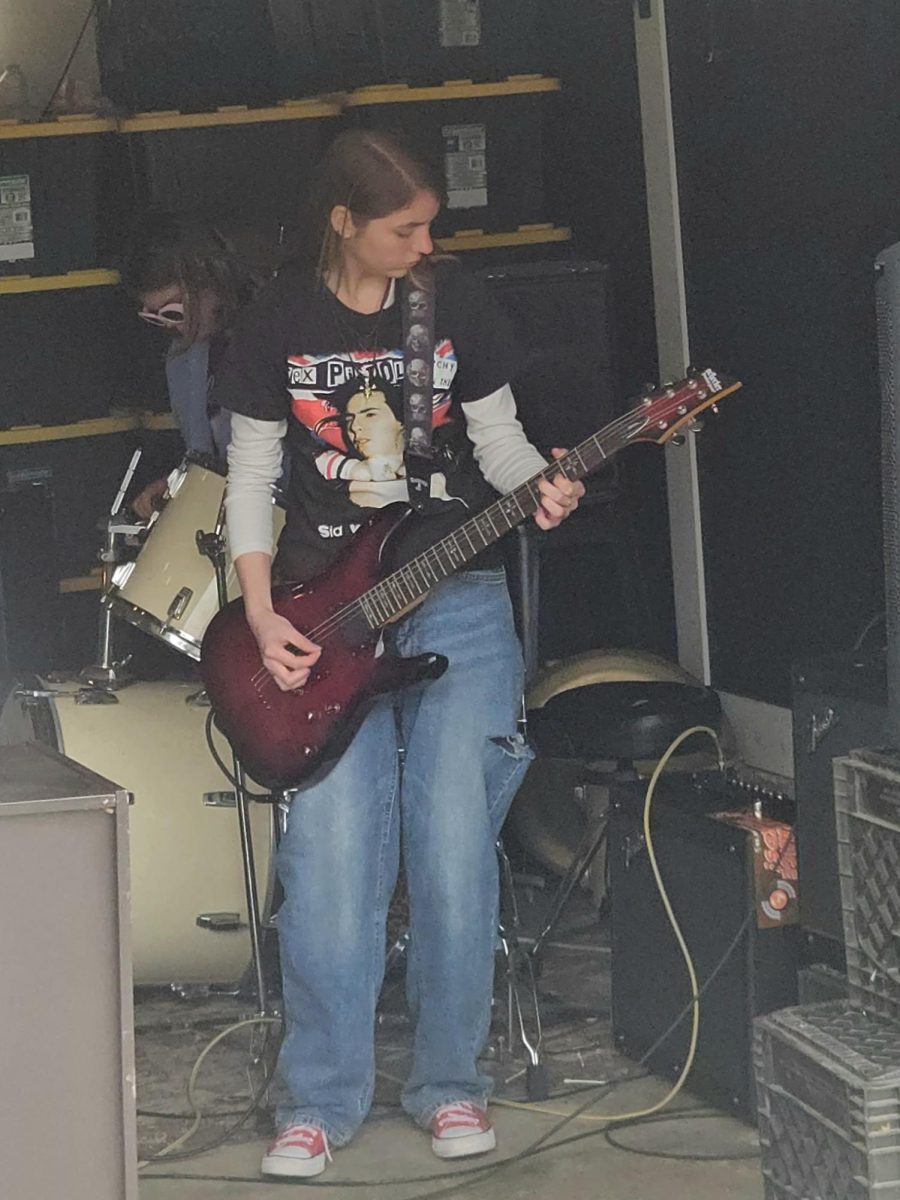Guitarist Addyson Magnus solos on the electric guitar. 