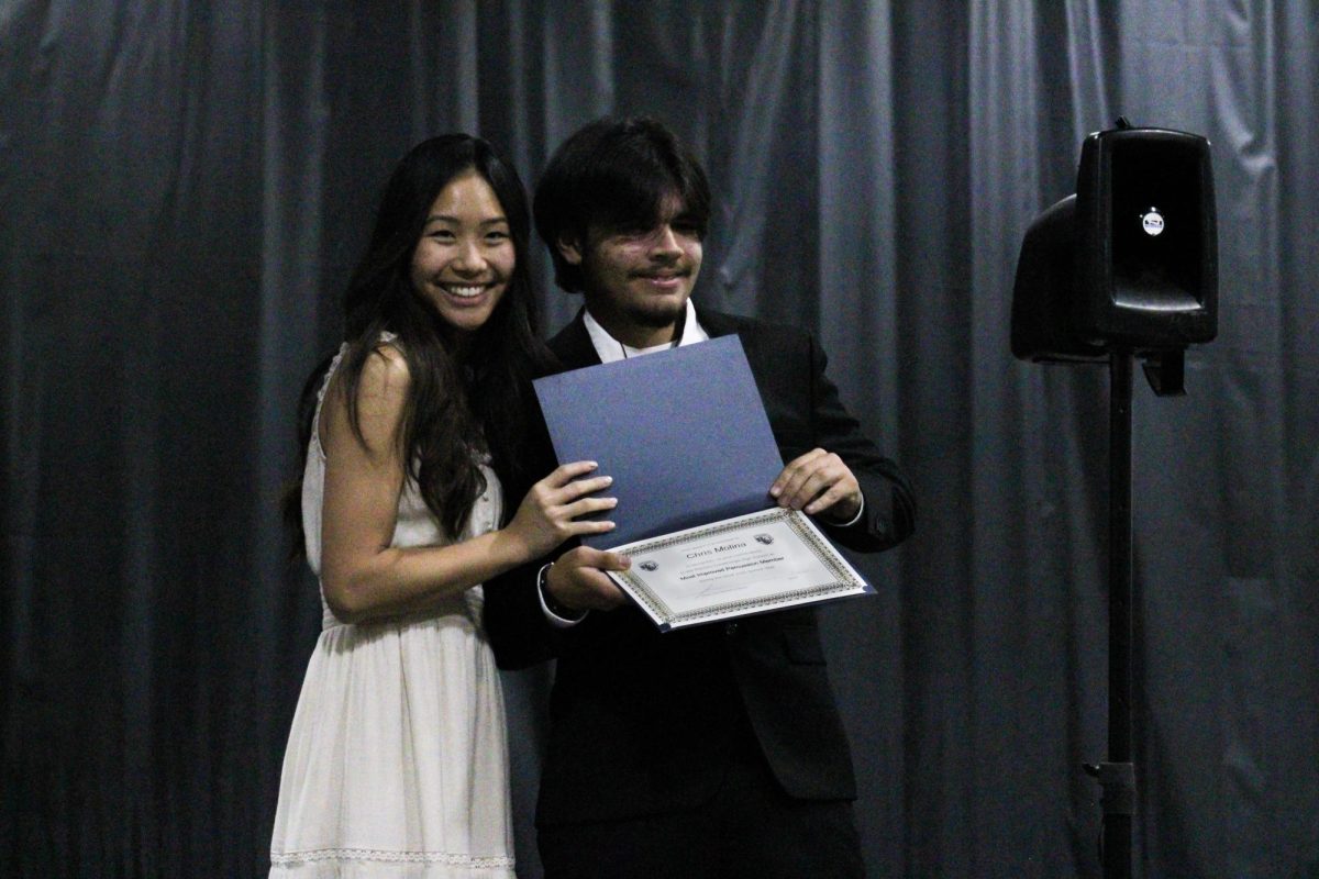 Sophomore, Christopher Molina, is awarded "Most Improved Percussion Member" by instructor Shirley Taylor.