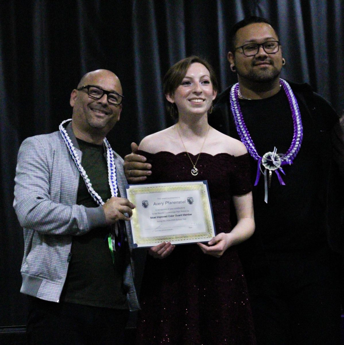 Sophomore, Avery Pfanenstiel, smiles for the camera after being awarded "Most Improved Color Guard Member" by her instructor Gabe Escondedo.