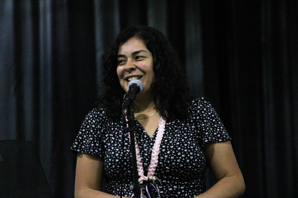 The Silver Jazz band's instructor, Susana Quinteros, speaks to the audience about the award. 