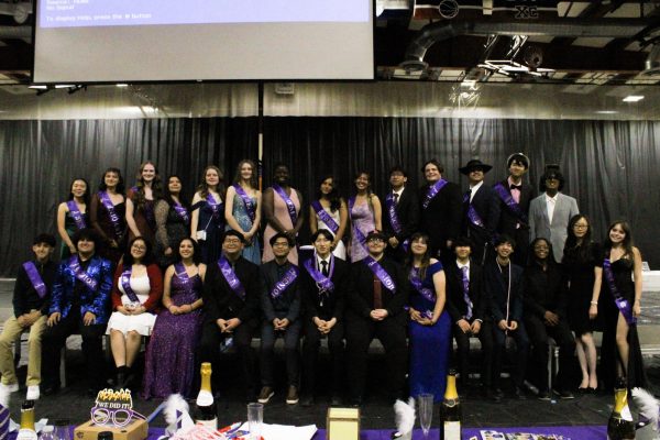 The seniors of the Rancho Cucamonga High School Marching Band gather to take one last picture together.
