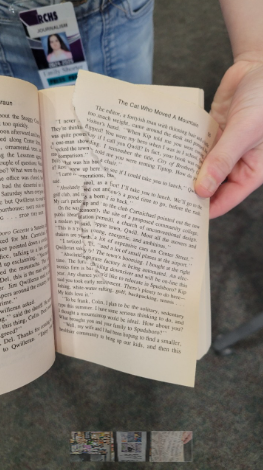 a hand tearing a page from a book