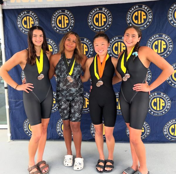 Sophomore Anastasya Gamboa, juniors Audrey Lee and Bella Fantocone, and Senior Megan Medina pose with their metals after they won their events in the CIF finals. 