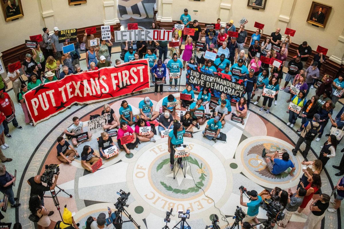 Demonstrators protest on the floor of the Capitol rotunda, during a legislative session as Democratic lawmakers, who left the state to deny Republicans the opportunity to redraw the state's 38 congressional districts, begin returning to the Texas State Capitol, in Austin, Texas, U.S. August 20, 2025. REUTERS/Sergio Flores