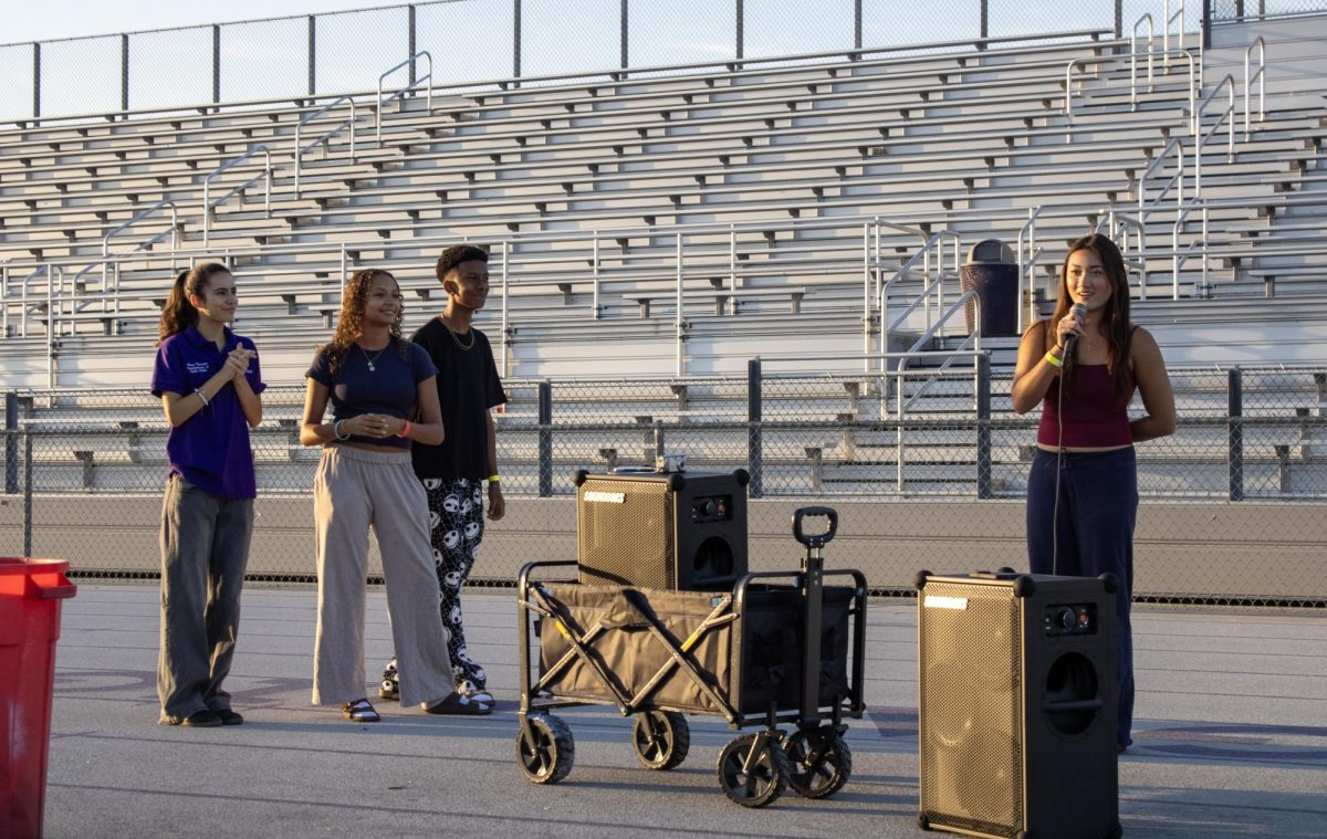 Senior Class Vice President Victoria Hong gives a speech about her hopes for the year alongside her fellow class officers senior Kai Wener and senior Charlotte Patio, helping to  start Senior Sunrise.