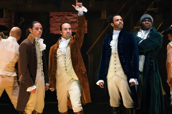 Anthony Ramos is John Laurens, Lin-Manuel Miranda is Alexander Hamilton, Daveed Diggs is the Marquis de Lafayette, and Okieriete Onaodowan is Hercules Mulligan in filmed version of 'HAMILTON'. Photo courtesy: Disney