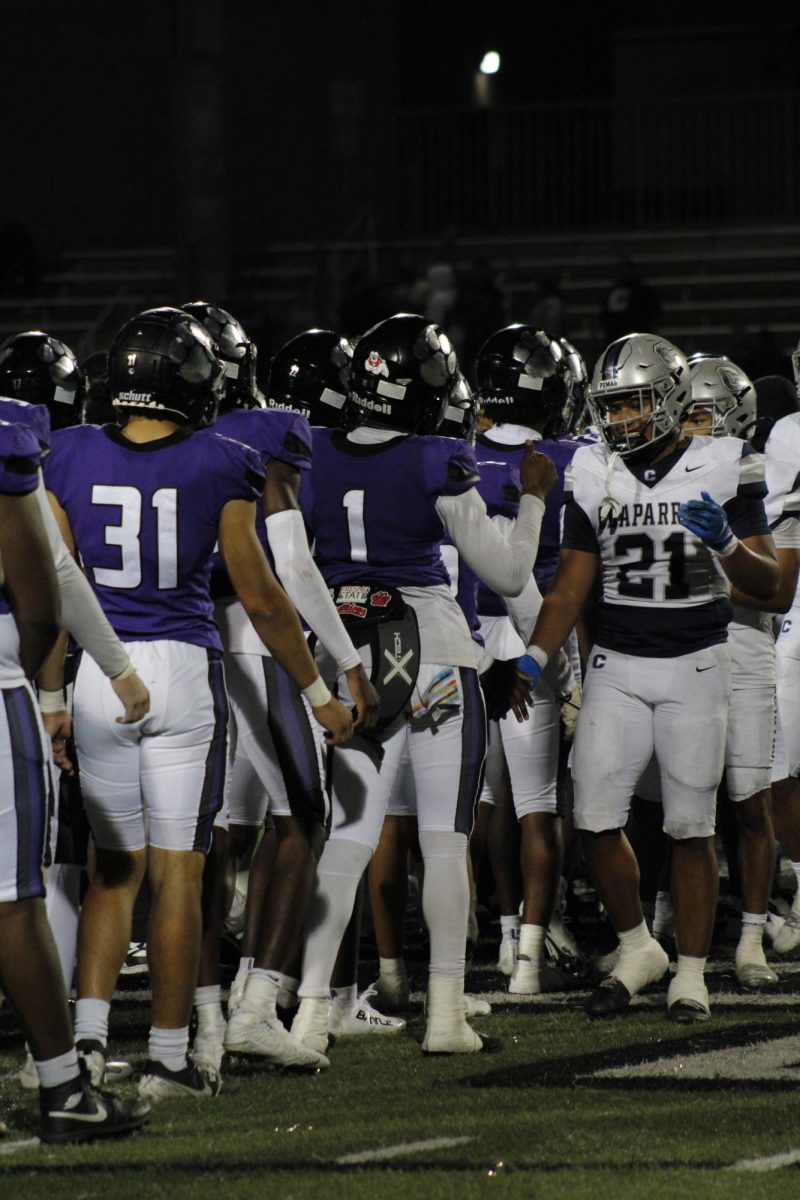 The RCHS football team shakes hands with Chaparral High school after the game