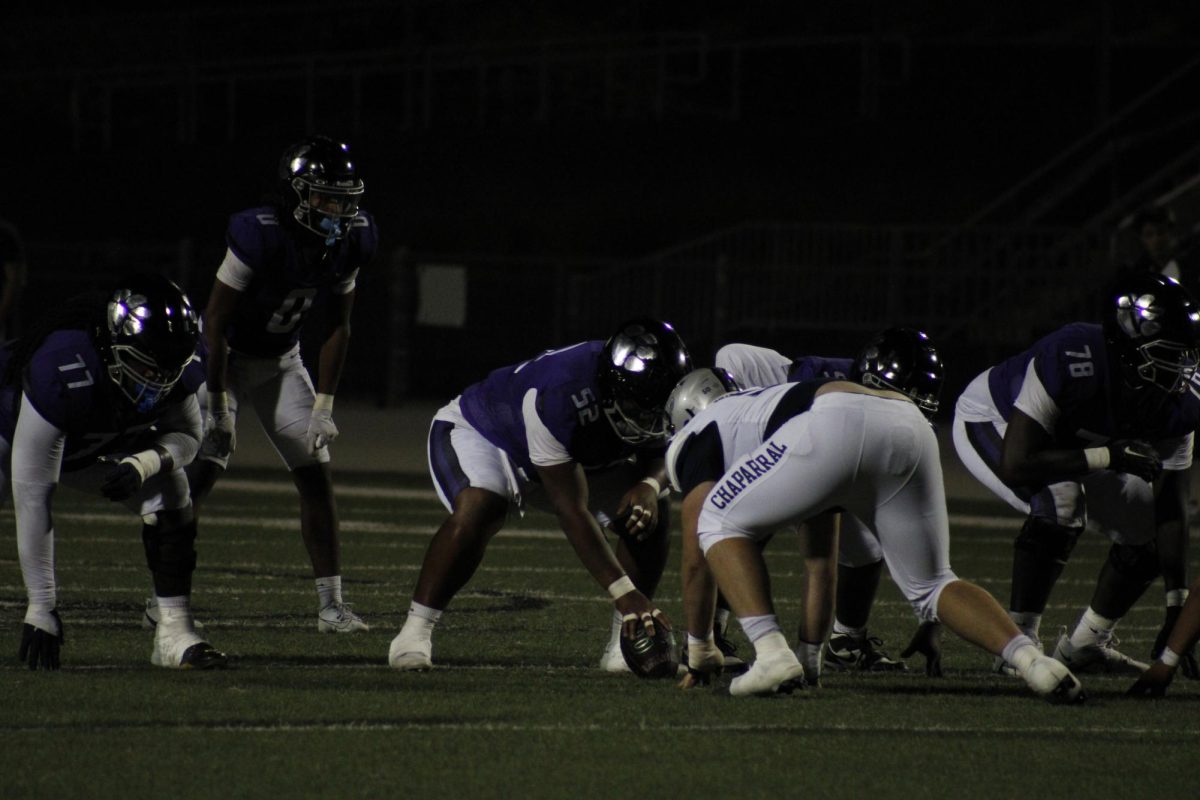 the RCHS offensive line sets up against Chaparral High School defense to go for a touchdown.