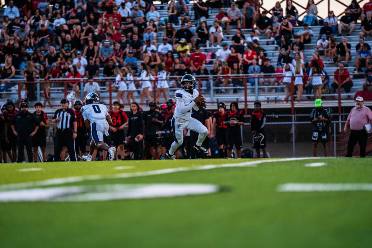 Senior Jacob Chambers prepares to throw the ball during a football game against Murrieta Valley. Photo courtesy: Gavin Escanuelas
