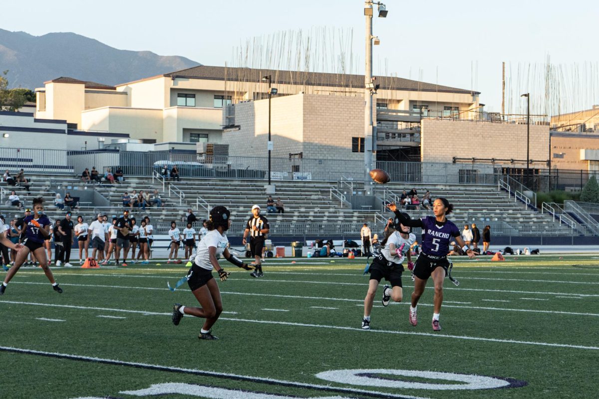 RCHS junior Lizzie Brown throws the ball against pressure from Santiago High School.