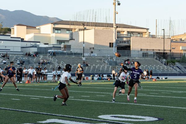 RCHS junior Lizzie Brown throws the ball against pressure from Santiago High School.