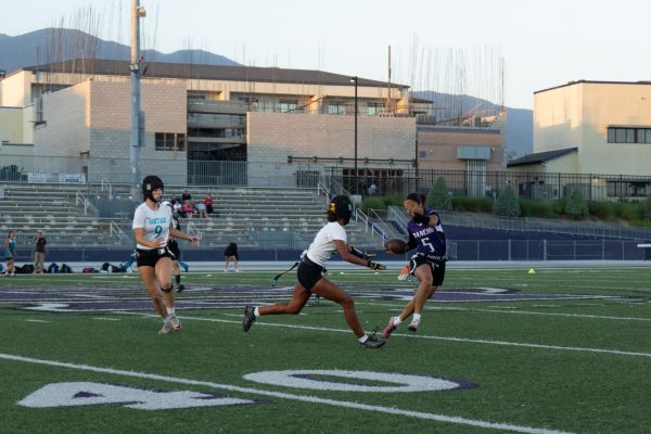 Senior Lizzy Brown evades a flag pull from the Santiago High School defense.
