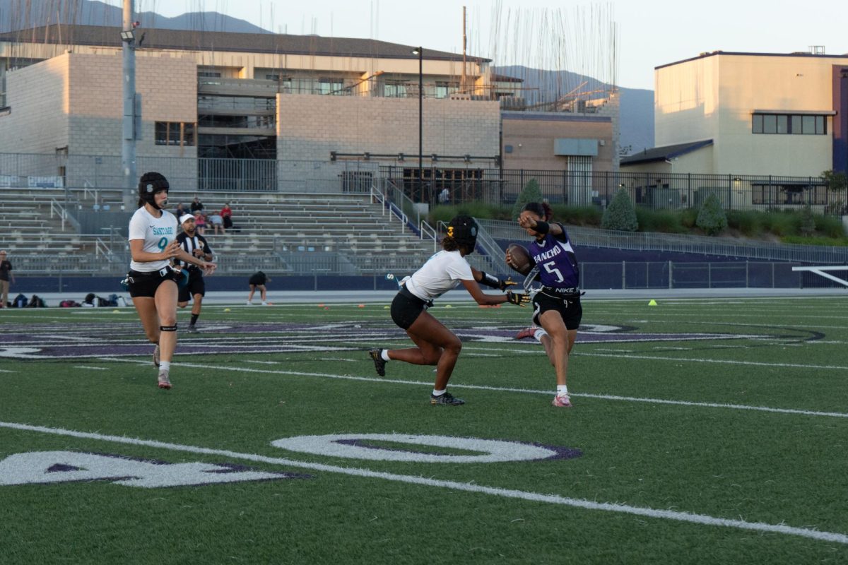 RCHS senior Lizzy Brown swivels her hips to avoid a tackle from Santiago High School.