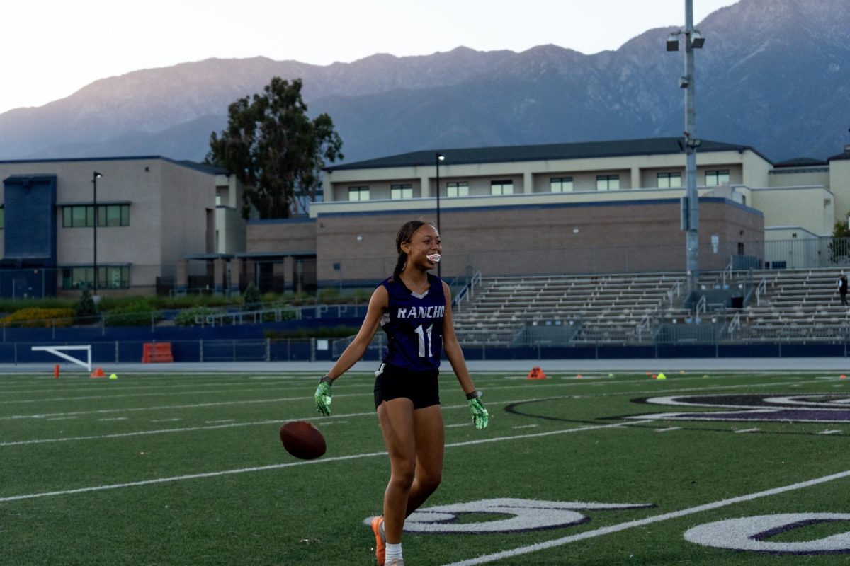 RCHS senior Antionette Green drops the ball and walks toward her team after intercepting the ball from Santiago High School. 