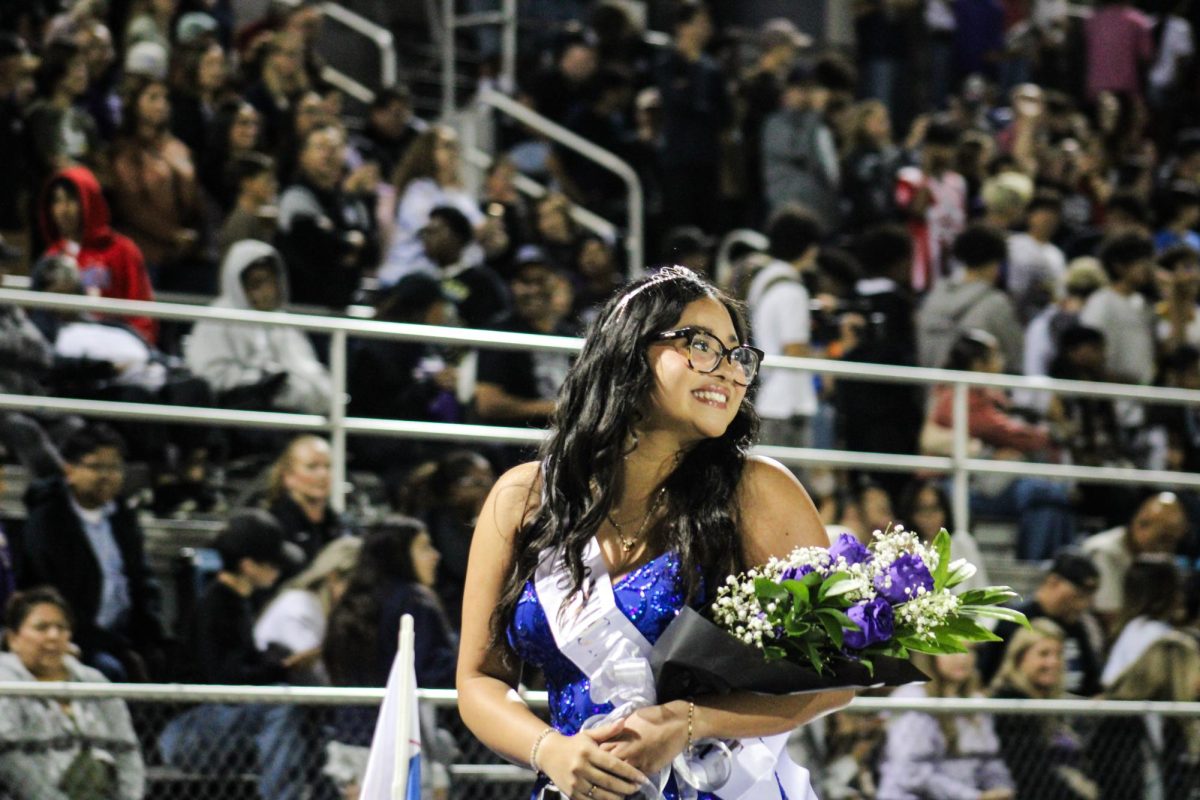 Princess number six, Lindsey Peralta at the homecoming parade with the other princesses
