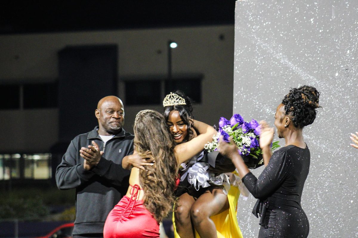 RCHS senior Imani Boiner receives hugs from her peers after becoming the homecoming queen.