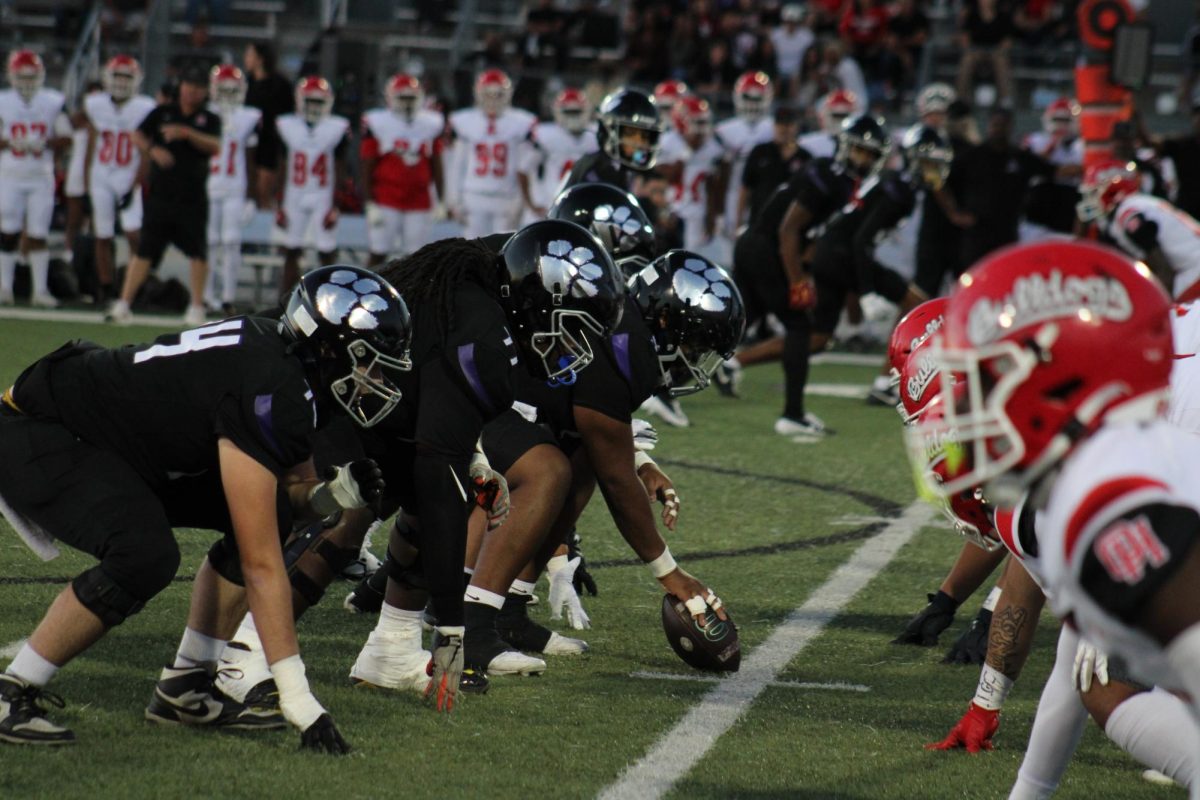 The RCHS offensive line sets up at the line of scrimmage against the Oak hills defensive line.
