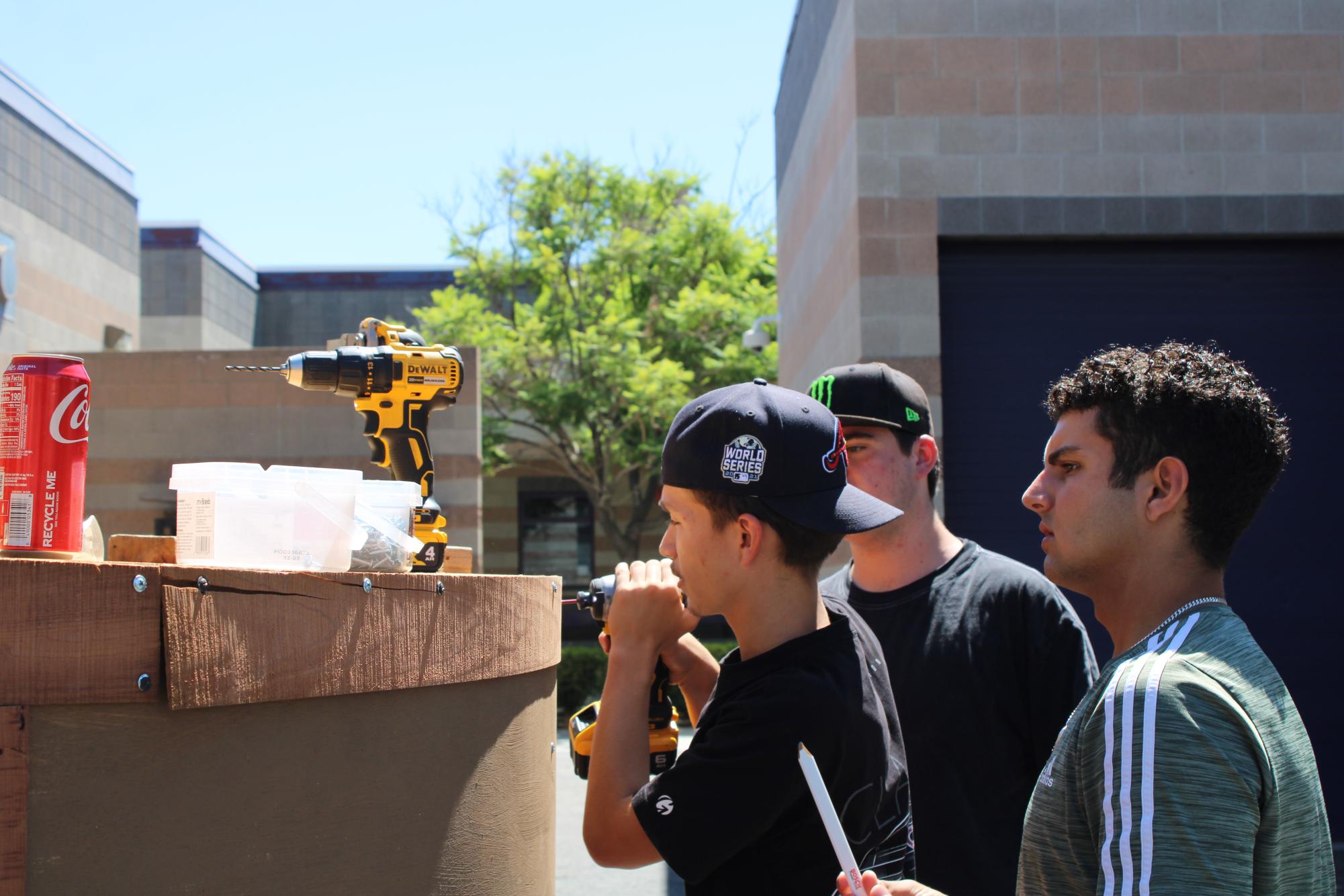 Advanced woodshop students work on the  main stage prop for the 2025 homecoming rally.
