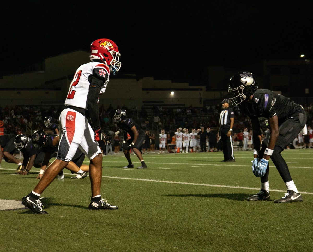 RCHS junior Nate Mensah readies himself against the opposing wide receiver from Oak Hills.