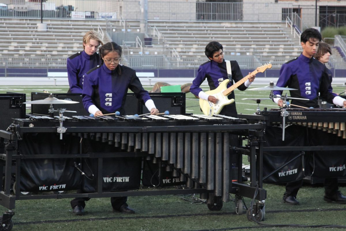 Part of the front ensemble practices during before show warm ups. 