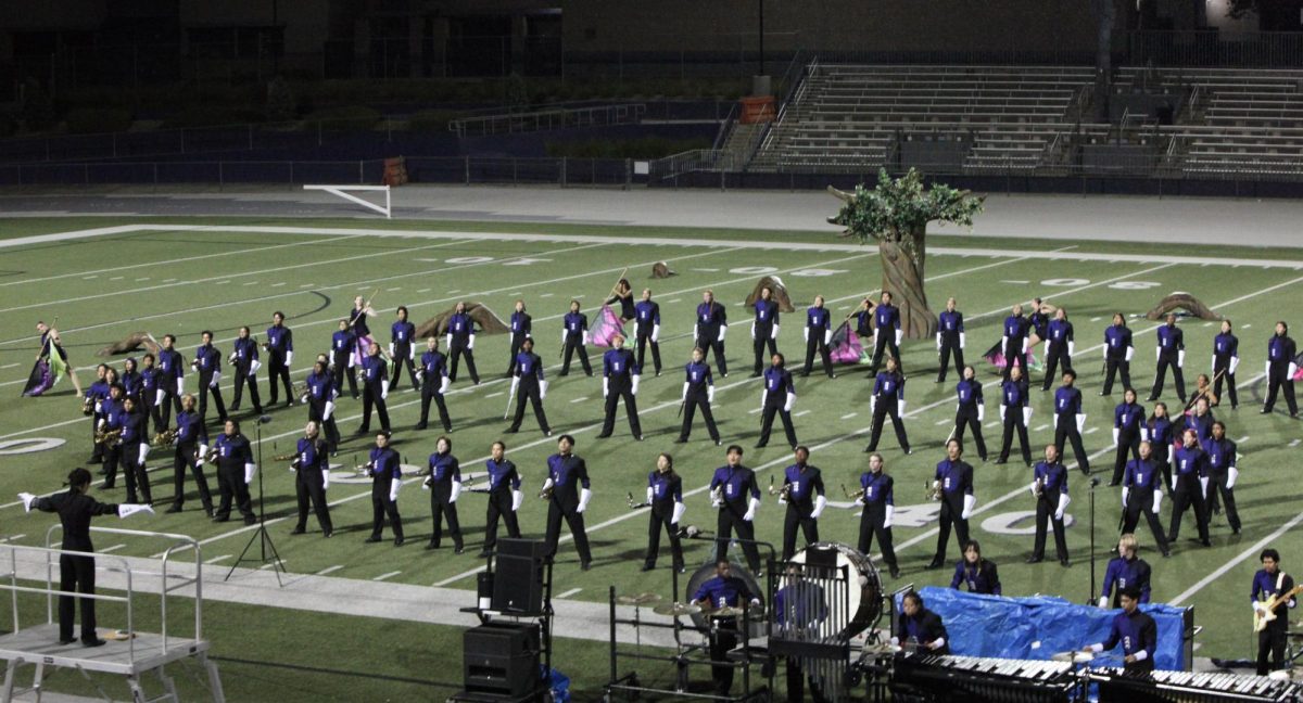 Performers form a spiral shape at the end of movement 1 going in to movement 2.