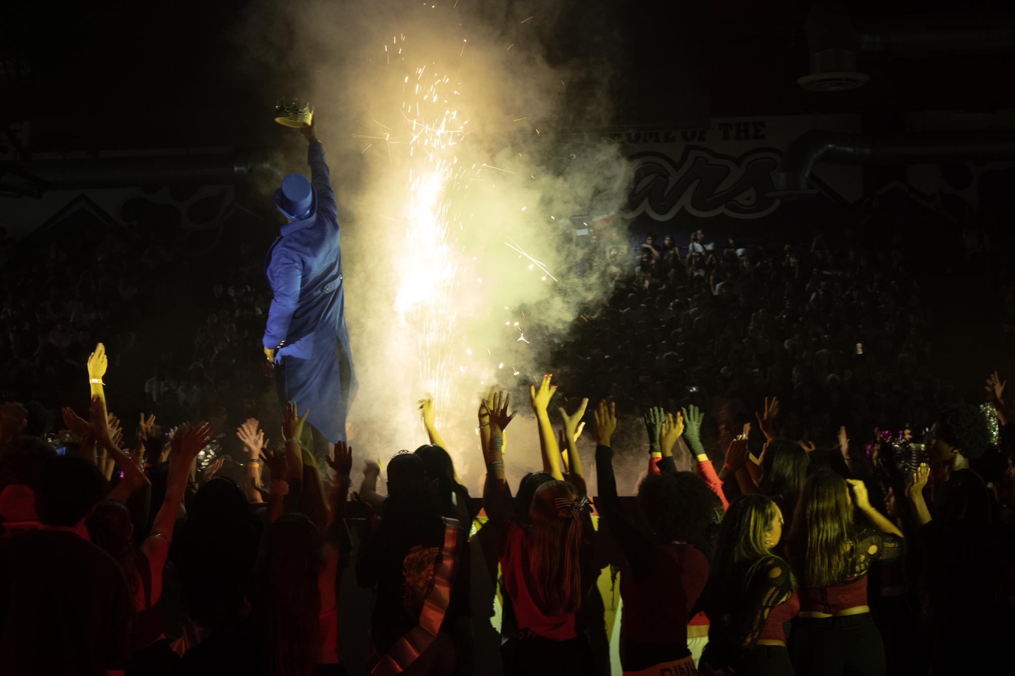 Mr. Aikens, and the student contributors of the homecoming rally come together to pose for the finale. 