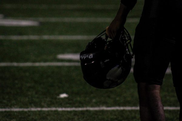 An RCHS football player walks off the field after winning first home game.