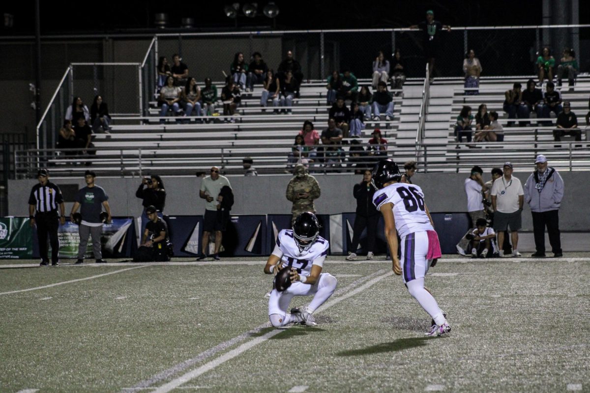 Senior Romano Annecchini kicks a field goal.