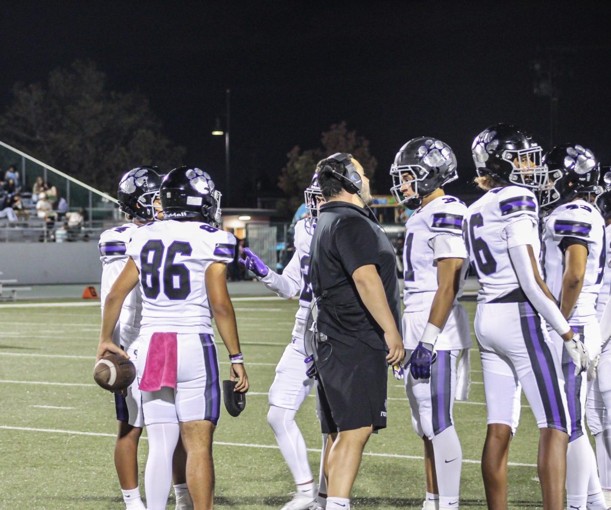 RCHS coach talking to one of the players.
