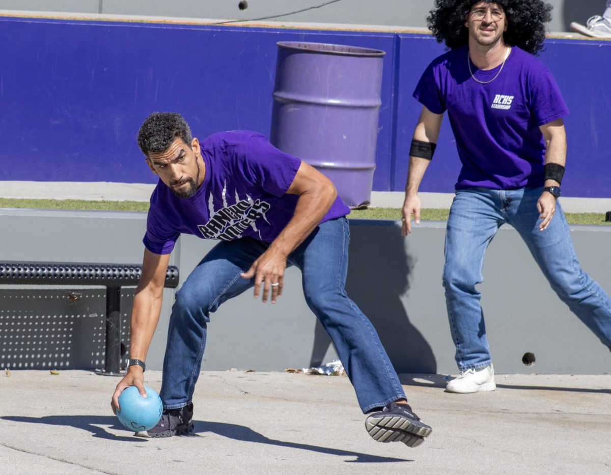 In the middle of this year's annual College and Career staff dodge ball game, (blank) teacher Mr, (first name) Vessup picks up a dodge ball, preparing to throw it at one of his fellow staff.
