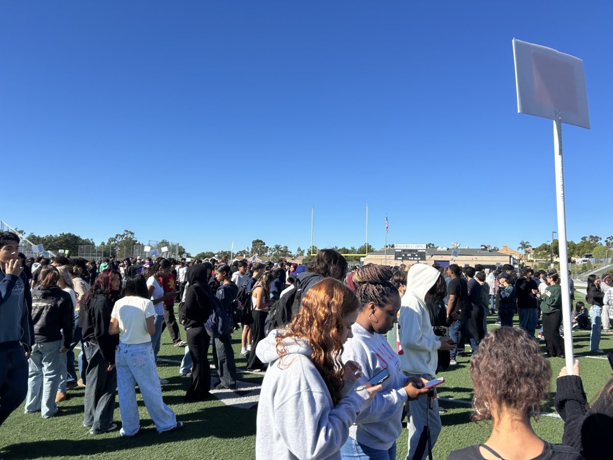 RCHS staff and students gather on the football field during the Great ShakeOut drill.
