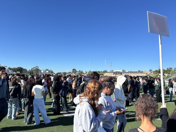 RCHS staff and students gather on the football field during the Great ShakeOut drill.