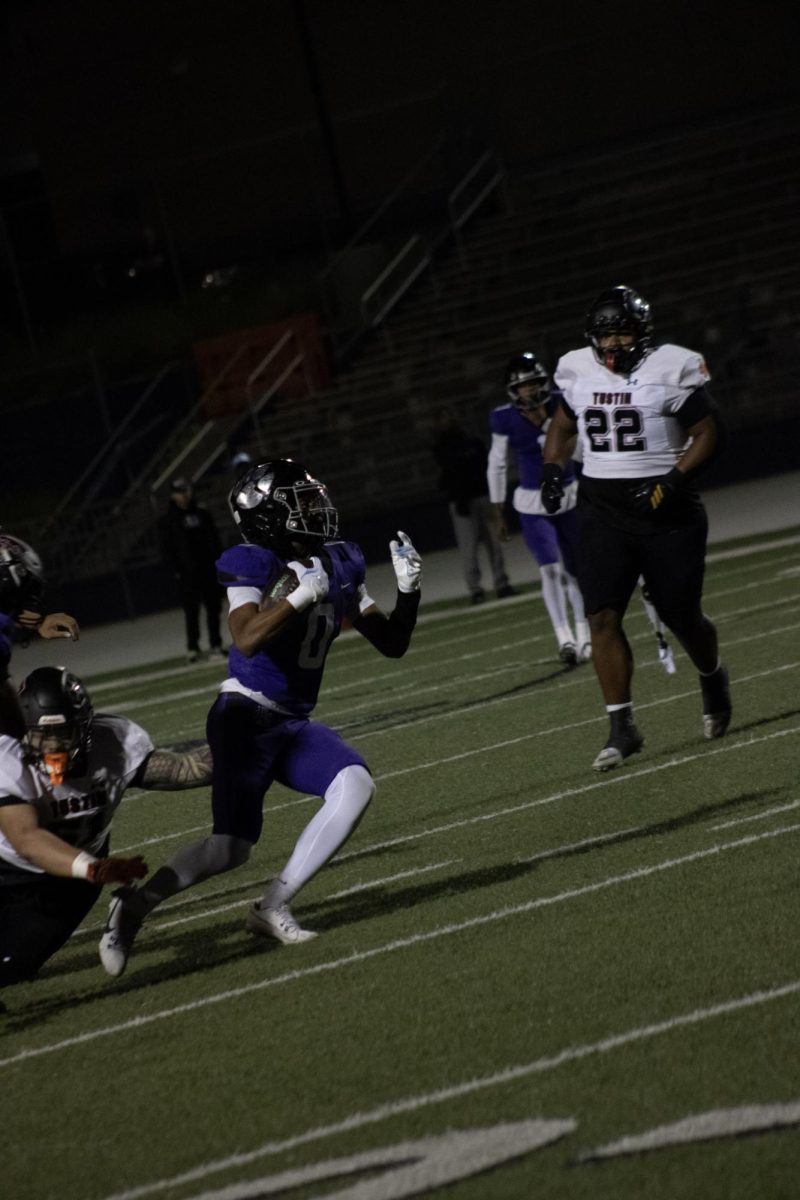 Senior James Strong III avoiding a tackle against Tustin in the first round of CIF playoffs.