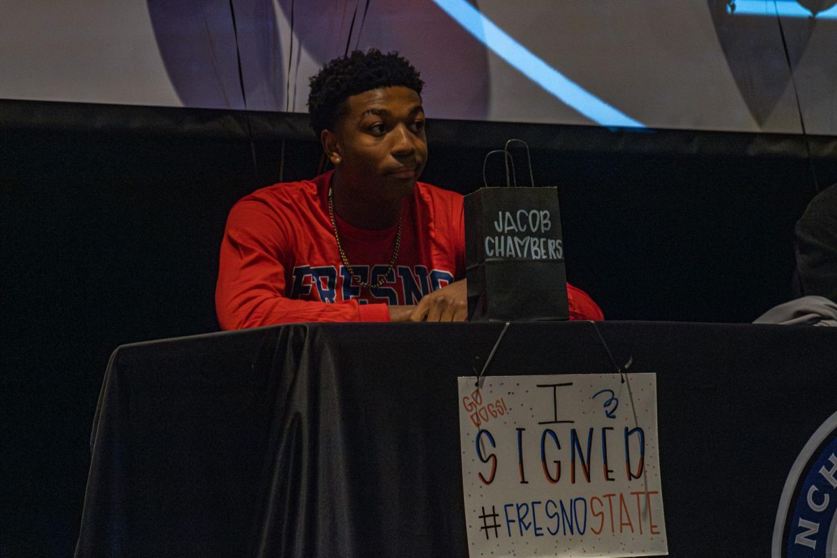 Jacob Chambers prepares to sign his commitment to Fresno State 
