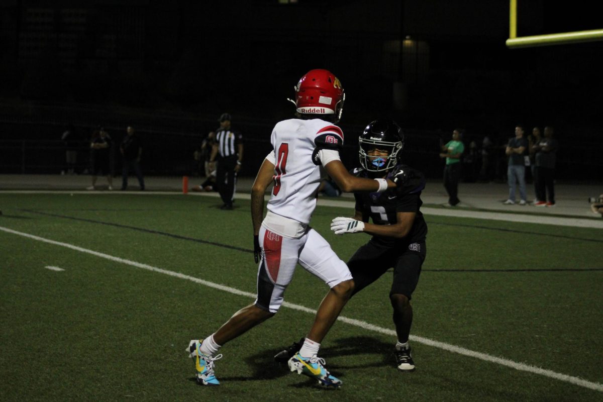 Senior Tyree Wilson guards an Oak Hills player during a kick return.