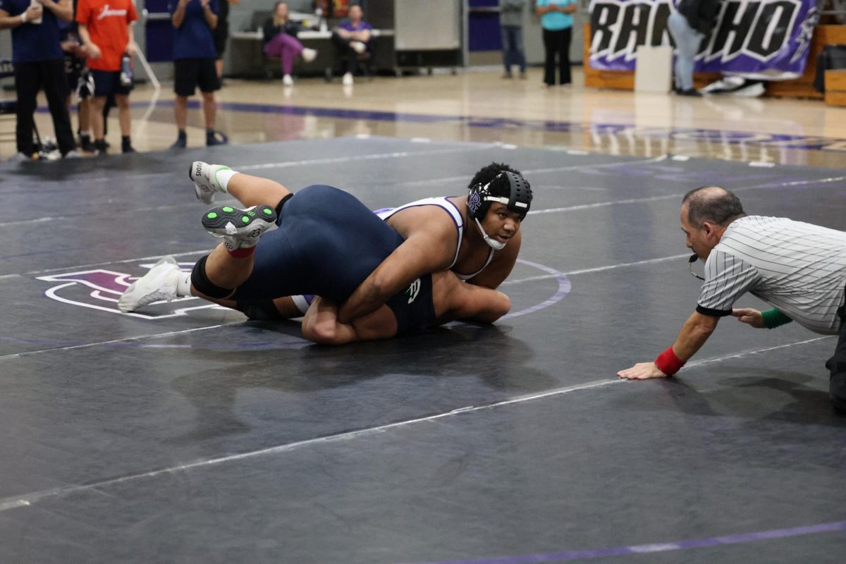 Senior Brayden Kilgore pins opposing Chino Hills wrestler to win the match.