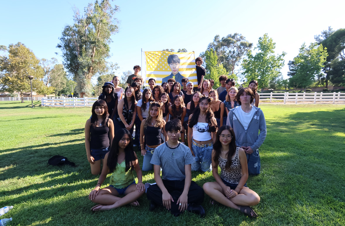 Key Club class of ‘27 across Chaffey Joint Union High School District poses for a photo with a flag of their president.