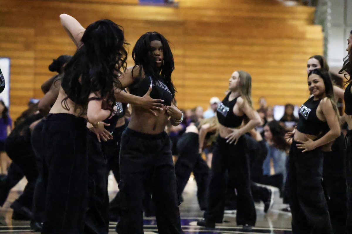 Senior Aeris Mitchell performs with JV dance at the 8th grade rally to welcome incoming freshmen.