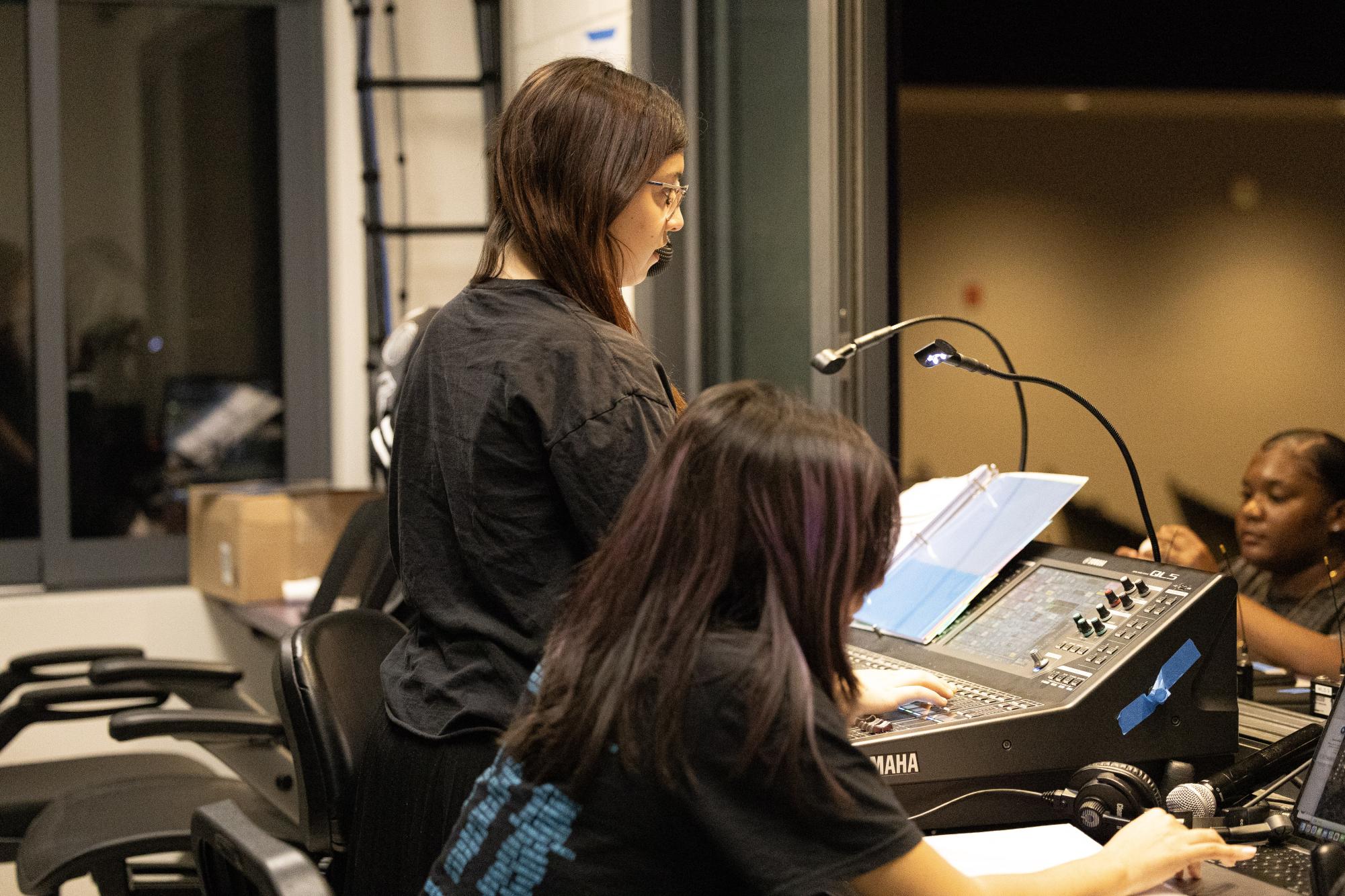 Senior Jamie Jaurequi looks out into the audience alongside junior Micayla Chavez.