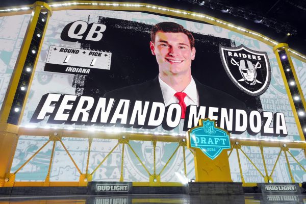 Apr 23, 2026; Pittsburgh, PA, USA; Indiana Hoosiers quarterback Fernando Mendoza is selected by the Las Vegas Raiders as the number one pick during the 2026 NFL Draft at Acrisure Stadium. Kirby Lee-Imagn Images