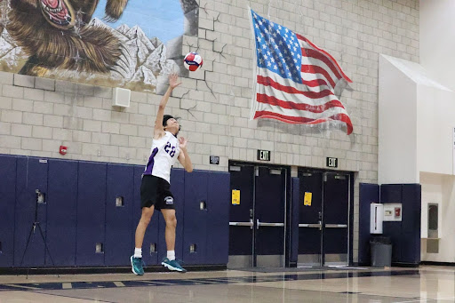 Varsity member senior Peter Son serves the ball in a game against Los Osos High School.
