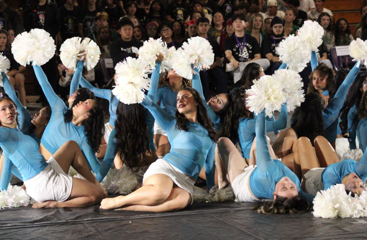 Varsity dance begins their pom-pom laden Ren-Rally routine.